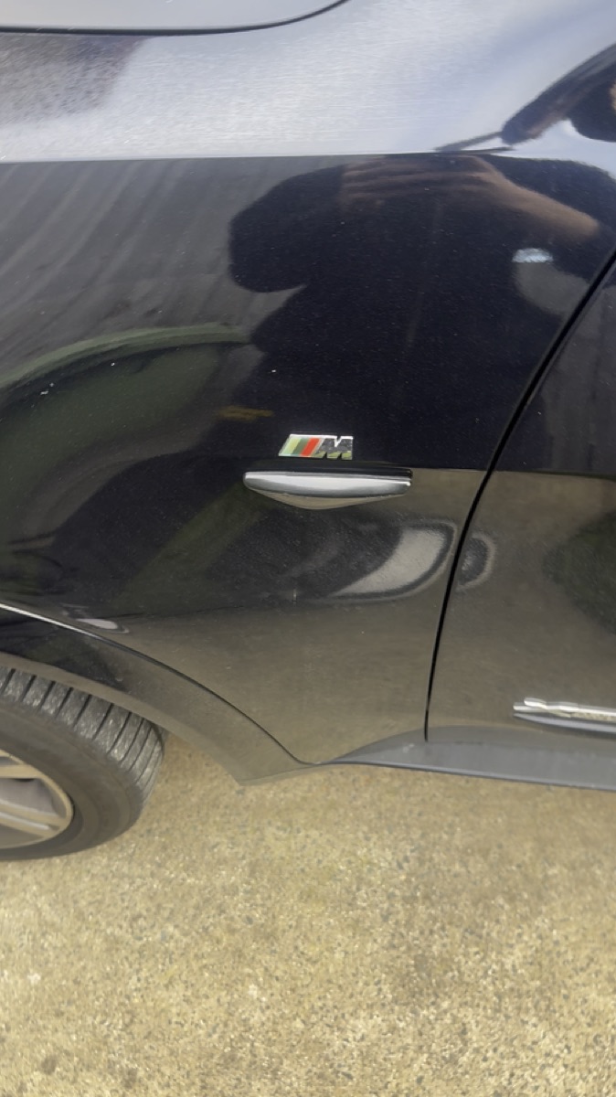M badge detail — Slick Detail Co.